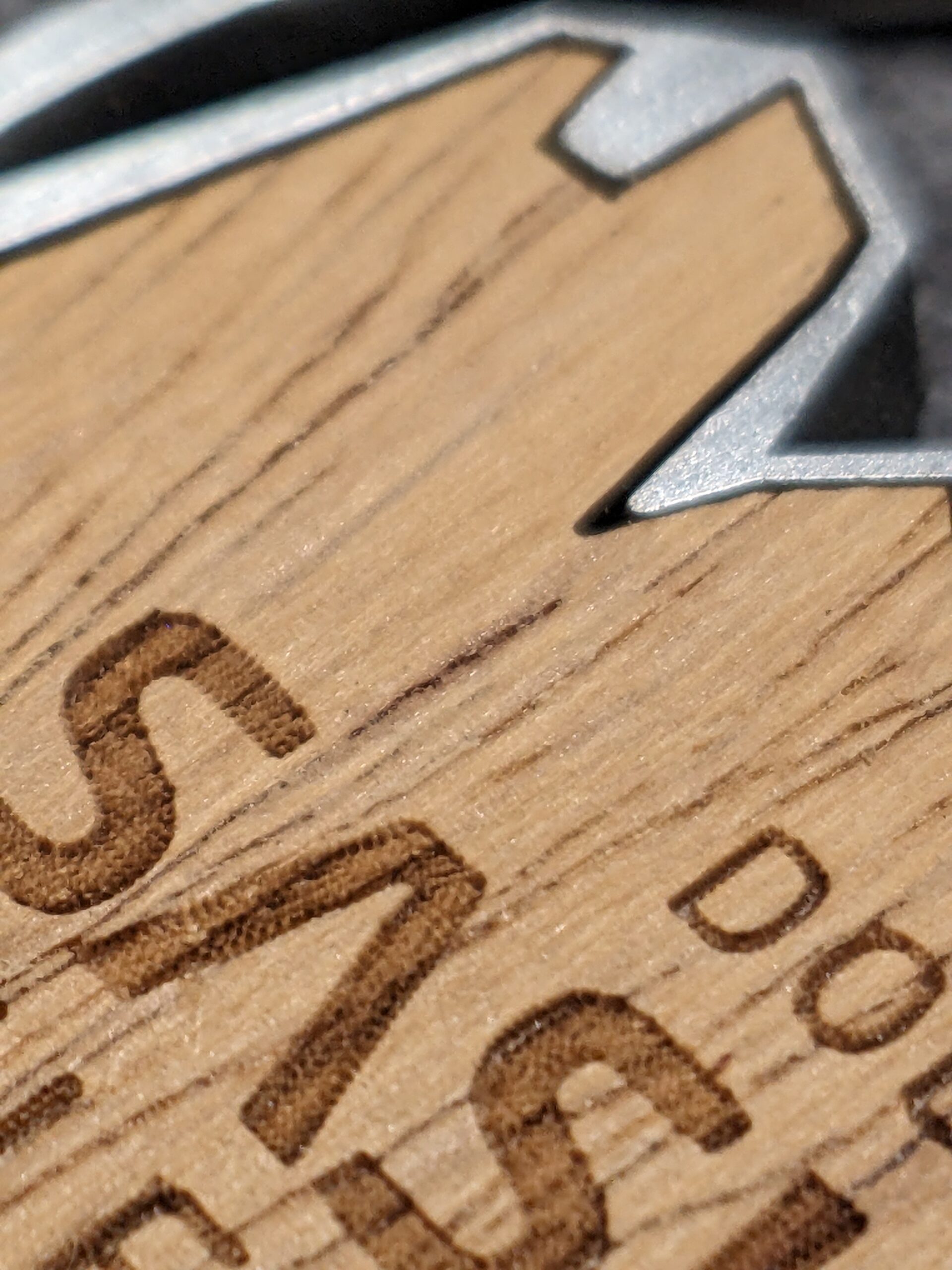 custom dolomites saslong halfmarathon medal in wood and metal embossed 2D antique silver finish with personalized sublimation ribbon detail view custom dolomites saslong halfmarathon medal in wood and metal embossed 2D antique silver finish with personalized sublimation ribbon detail view
