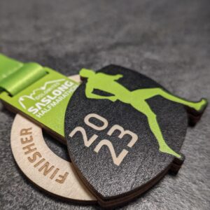 custom saslong half marathon medal made of natural wood laser cut and uv printed with stacked layers with personalized sublimation ribbon side view