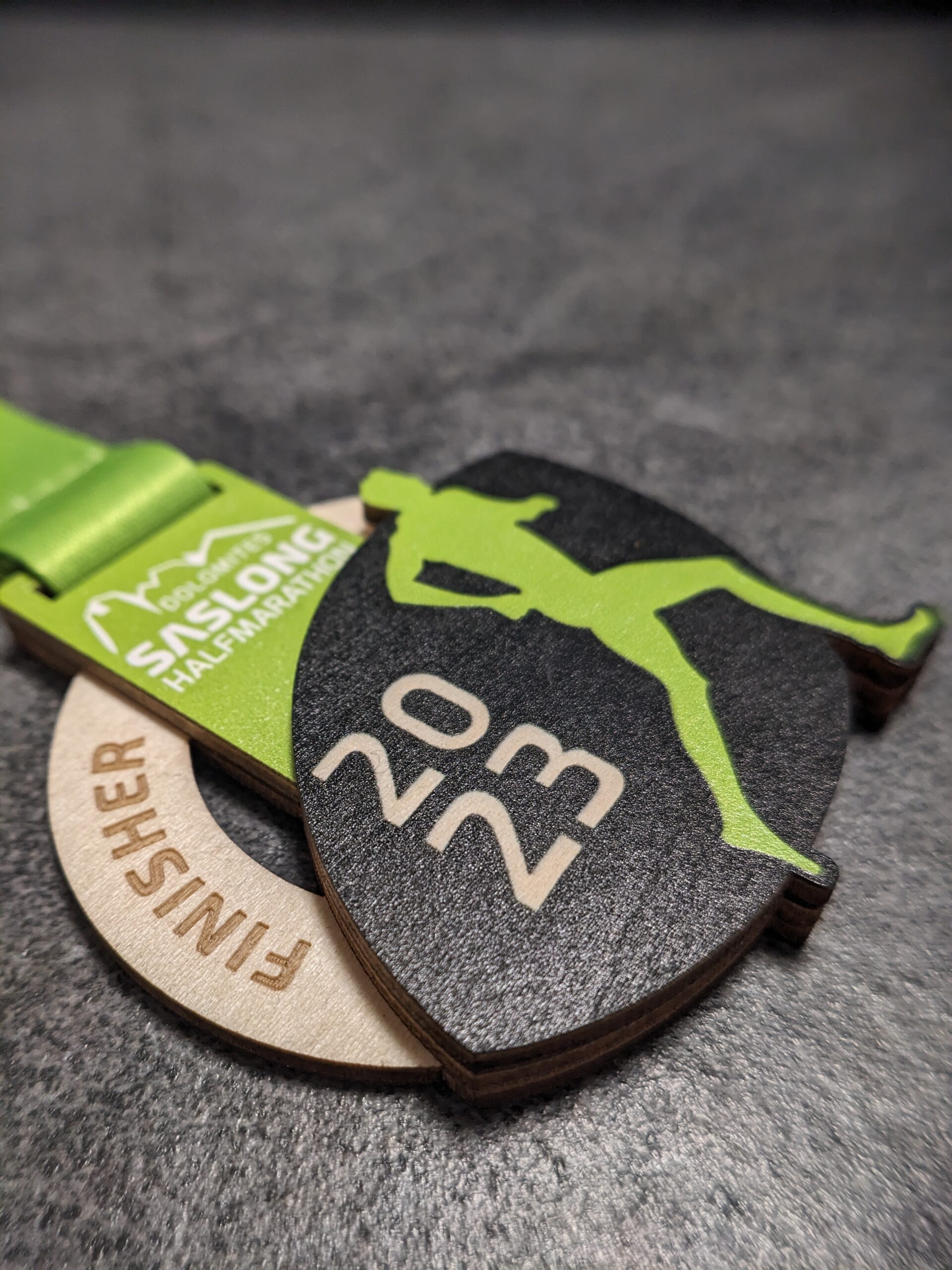 custom saslong half marathon medal made of natural wood laser cut and uv printed with stacked layers with personalized sublimation ribbon side view custom saslong half marathon medal made of natural wood laser cut and uv printed with stacked layers with personalized sublimation ribbon side view